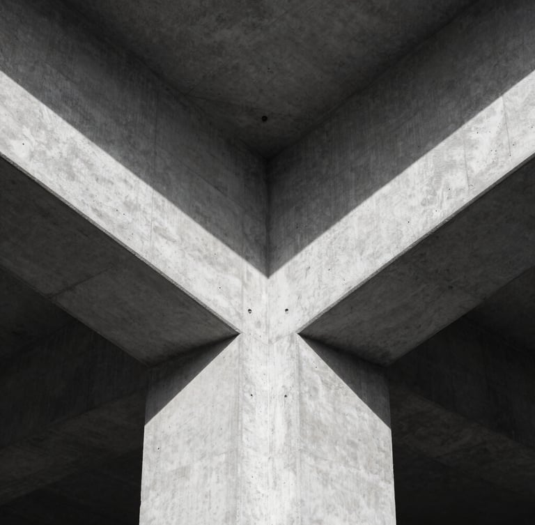 Symmetrical architectural detail of a concrete cantilever structure, harsh natural light, sharp geometric shadows, minimalist composition