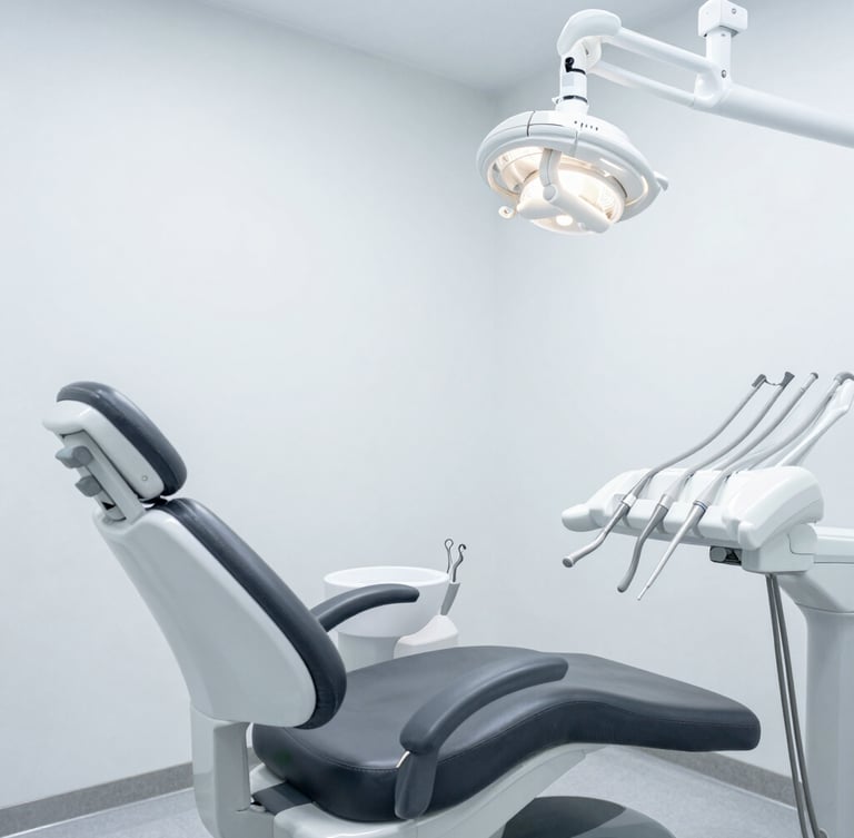 Wide architectural shot of a minimalist, clinical dental operatory, cool diffused lighting, matte-finish instruments visible, sterile slate gray tones.