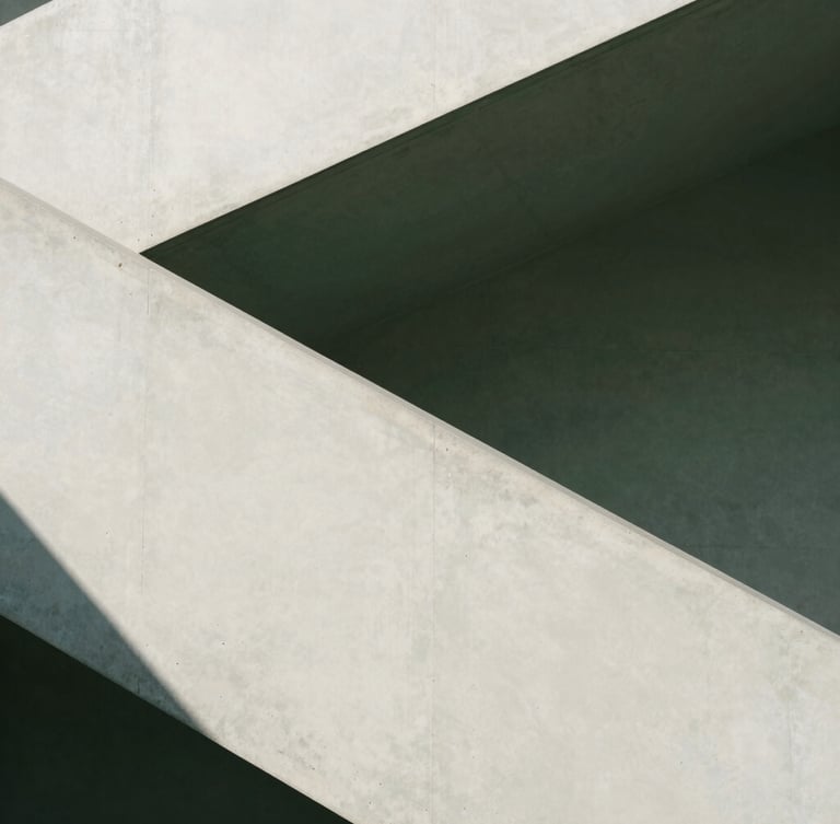 Minimalist modern architectural concrete staircase casting sharp geometric shadows under bright natural light, editorial photography, 35mm lens