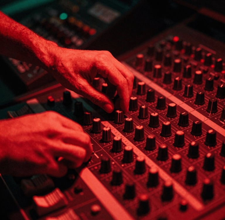 Close-up of hands adjusting dials on a vintage mixing console in a dark studio, harsh red neon light casting deep shadows, 35mm grain