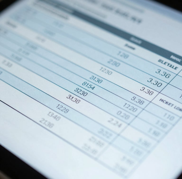 Macro close-up of a digital screen showing a technical calibration report, cool daylight, sterile blue tones, sharp focus on data columns.