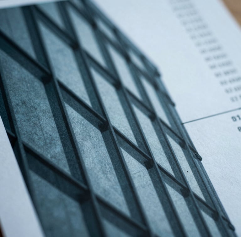 Close-up of a printed financial report with sharp architectural shadows, cool overcast daylight, 35mm