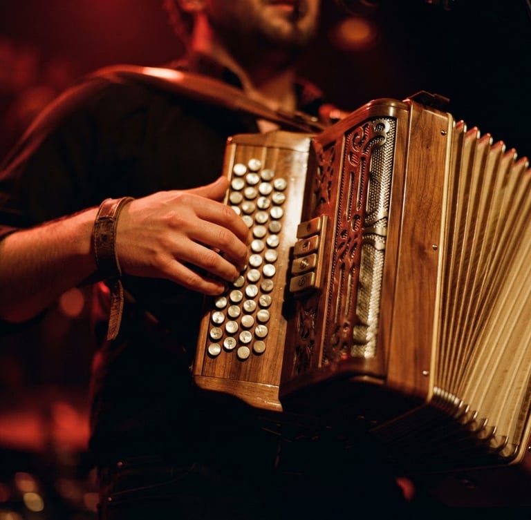 Close-up of a polished wooden accordion being played under dramatic warm stage lights, rich crimson tones, shallow depth of field