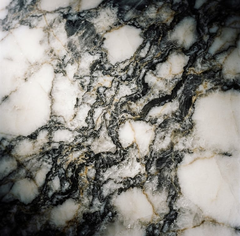 Extreme macro close-up of premium Calacatta marble veins, dramatic low-key side-lighting, deep charcoal and gold undertones, sharp focus