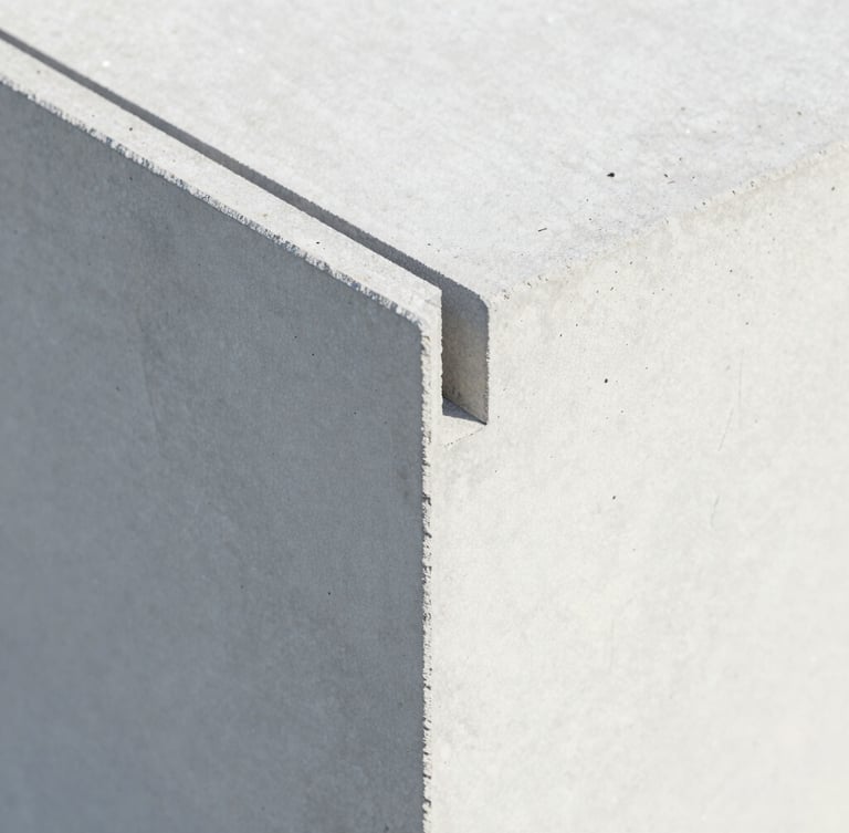 Close-up of lightweight concrete panel interlocking joint, showcasing the high-precision engineered texture, bright studio lighting, clean architectural detail