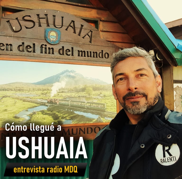 Ushuaia a man in a black jacket and a sign that says ushuala