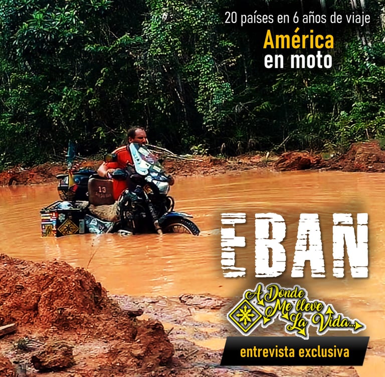 a man riding a motorcycle through a muddy road