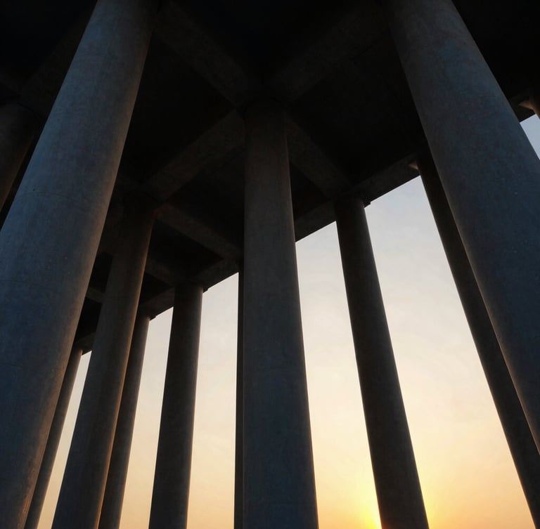 Dramatic low-angle view of massive structural steel columns rising into a golden hour sky, architectural precision, cinematic lighting
