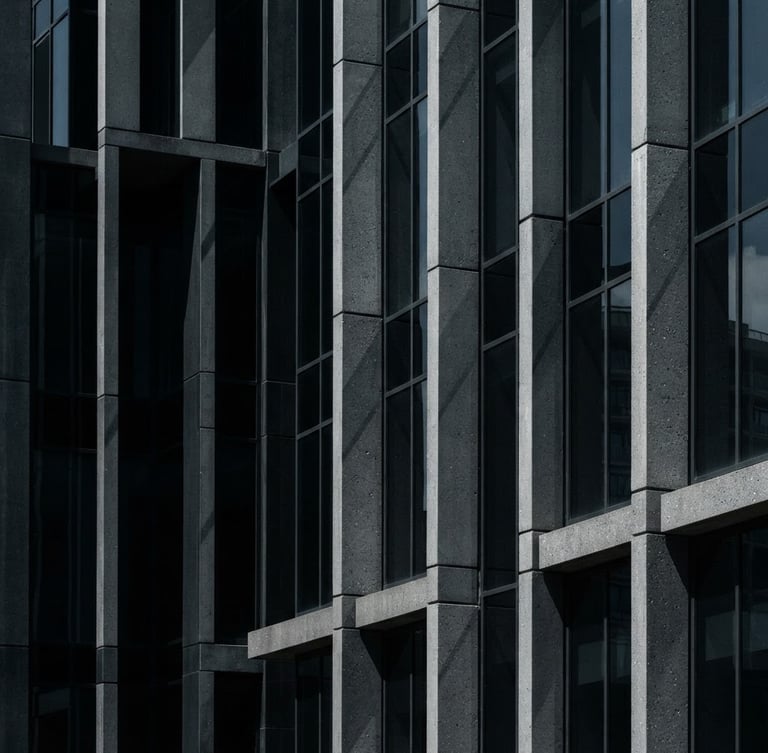 Tight, geometric crop of architectural details of modern corporate concrete and glass facade, high-contrast natural daylight with sharp shadows, deep slate tones.