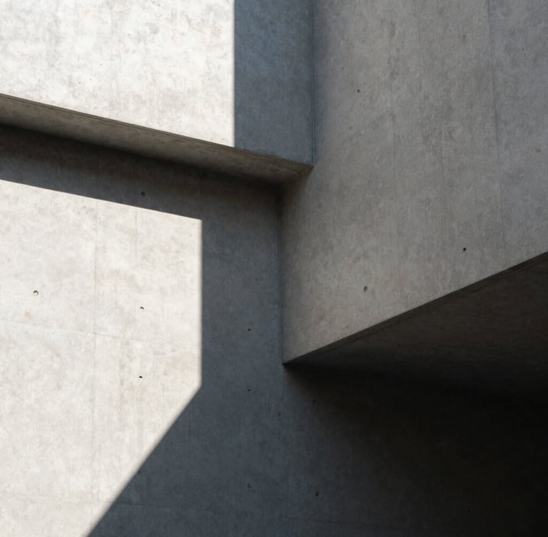 A high-contrast architectural corner with sharp, geometric concrete shadows cast by hard natural light, clean lines, minimalist composition.