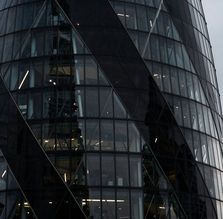 Macro architectural detail of the Shard in London, sharp steel and glass angles casting harsh geometric shadows under cool-toned low-key lighting, high contrast, 35mm lens