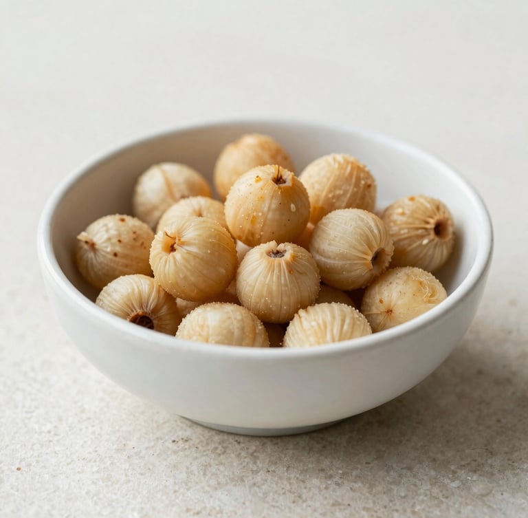 Close-up of slow-roasted makhana in a minimalist ceramic bowl on a clean stone surface, soft natural daylight, shallow depth of field, 35mm