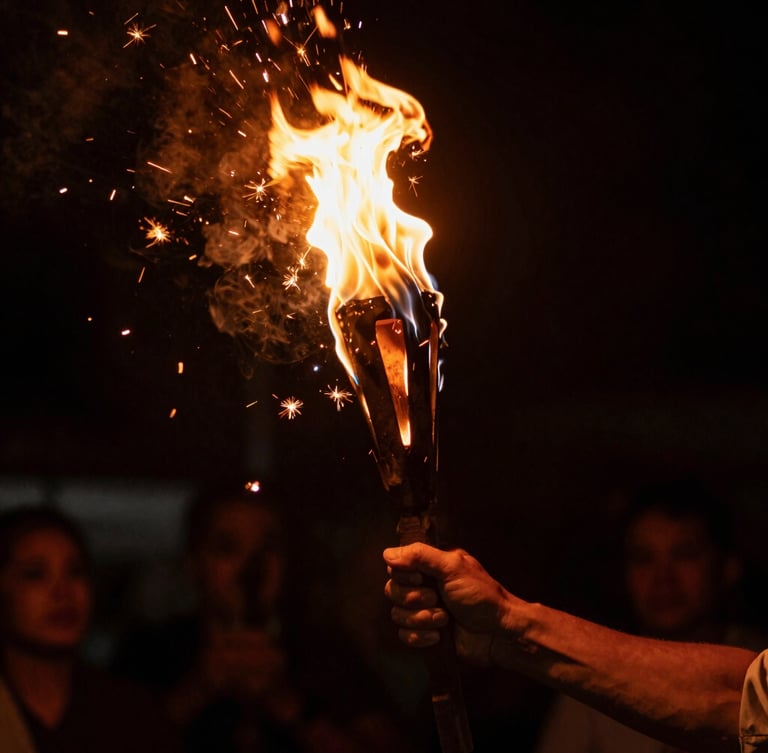 Low-key, high-contrast close-up of hands holding a burning torch during a traditional solstice festival, dramatic orange sparks flying against a deep black background, warm solar flares.