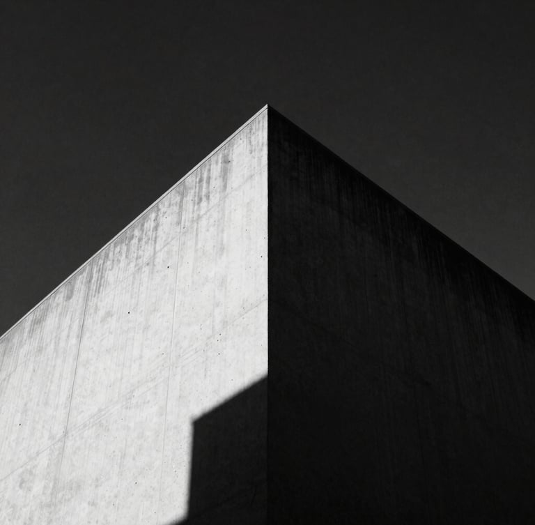 Low-angle high-contrast black and white photograph of a sharp concrete building corner slicing into a dark sky, harsh direct sunlight, deep shadows, 35mm film