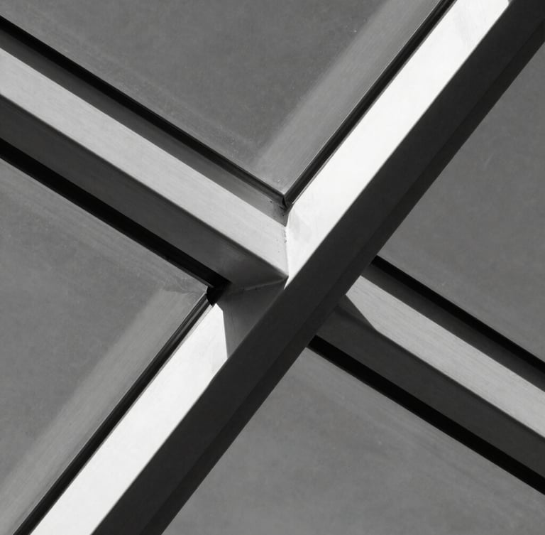 Extreme macro crop of steel and glass structural elements intersecting, high contrast charcoal and white tones, sharp focus, direct sunlight