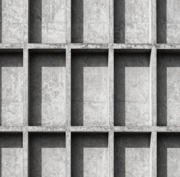 Minimalist architectural photography of a brutalist concrete building facade, harsh direct sunlight casting sharp geometric shadows, high contrast charcoal and white tones, 35mm lens
