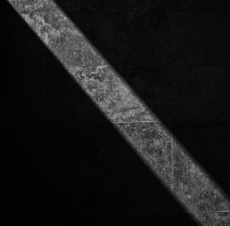 Abstract dark architectural photography of a monolithic black concrete wall, sharp directional light casting dramatic shadows, high-contrast monochrome, 35mm.