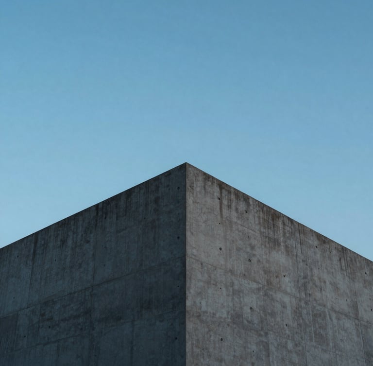 Wide-angle minimalist architectural photography of a modern concrete peak structure against a crisp daylight sky, cool sapphire tones, sharp focus, 35mm