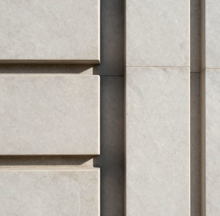Portrait-oriented close-up of honed marble and brushed steel architectural detail, crisp high-contrast daylight, sharp focus, minimalist neutral tones, sleek architectural photography.