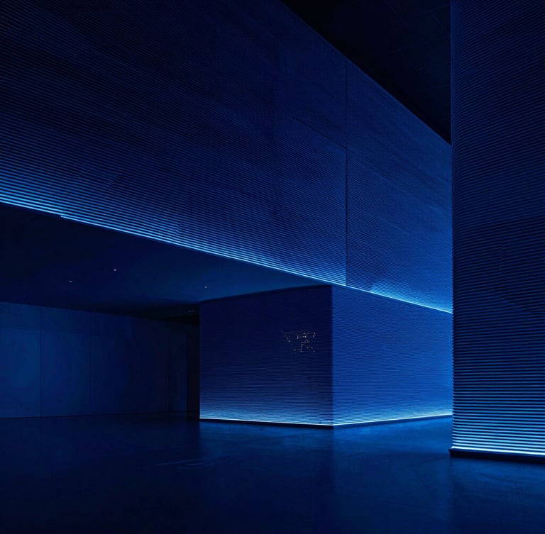 Sleek high-contrast technology photography, extreme wide-angle architectural shot of a minimalist London office interior, sharp cool blue studio lighting, deep navy shadows, high-density lines