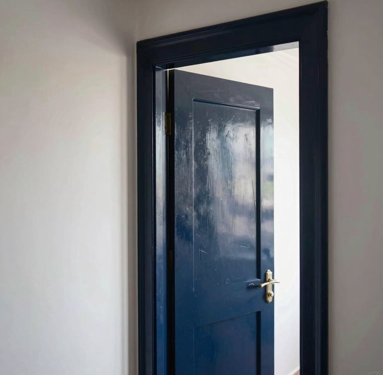Crisp architectural view of a Dutch residential interior hallway, razor-sharp paint lines on a deep navy door frame against a chalk-white wall, soft morning daylight.