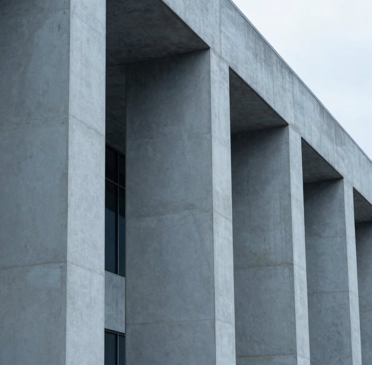 Abstract architectural detail of concrete and steel pillars, clean geometric lines, cool overcast daylight, minimalist corporate aesthetic, desaturated blue and slate tones