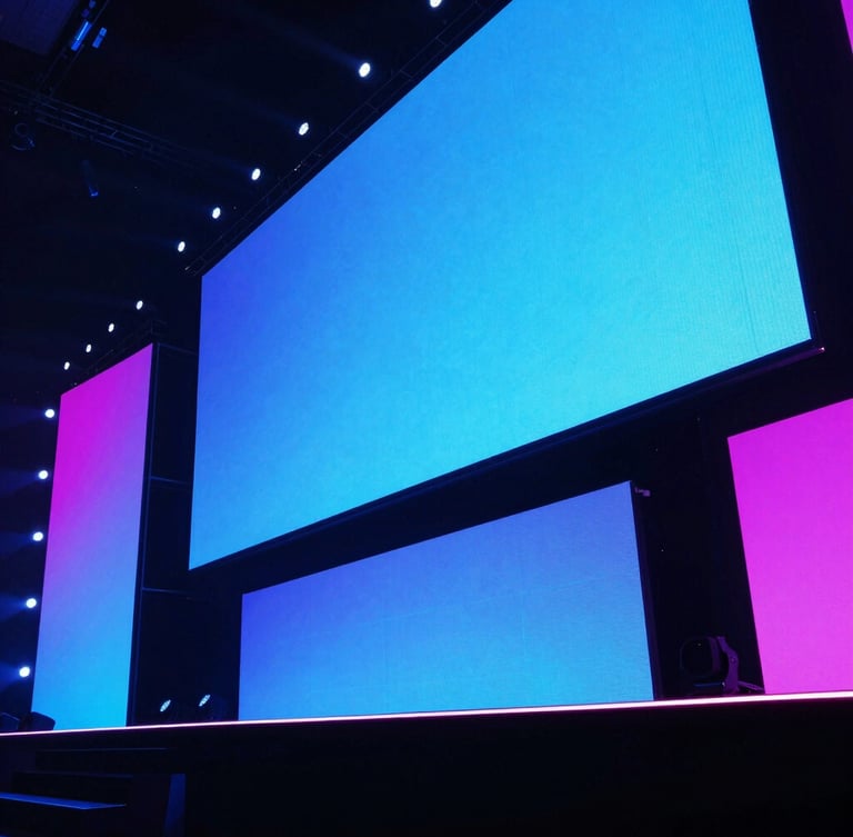 Low-angle dramatic shot of a massive corporate stage, sharp neon blue and magenta backlighting, crisp LED screens, ambient venue glow, 35mm