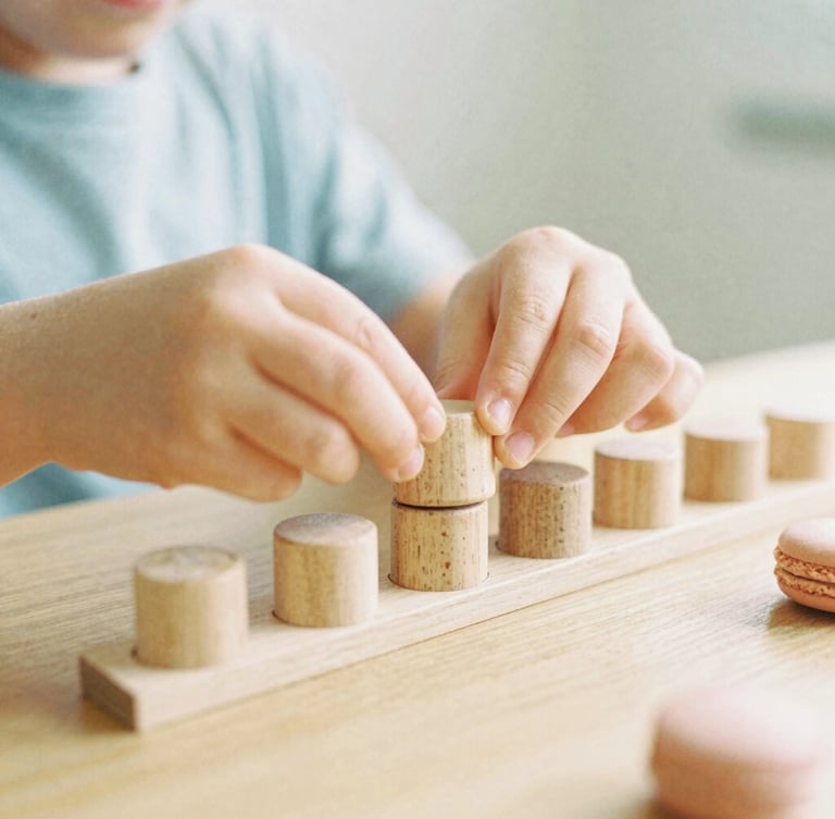 Candid eye-level shot of a child's hands carefully placing natural wooden cylinders into a matching block, soft morning daylight, shallow depth of field, 35mm film style.
