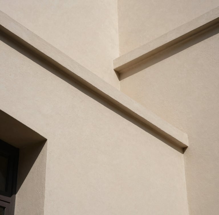 Close-up architectural detail of shadow lines on a smooth plaster wall, warm natural daylight, minimalist aesthetic, muted organic tones.
