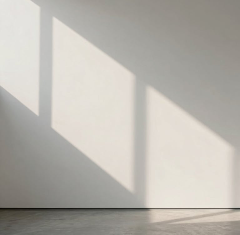 A clean, straight-on architectural view of soft morning light casting long, geometric shadows on a smooth, off-white gallery wall, minimalist, peaceful, organized, no people.