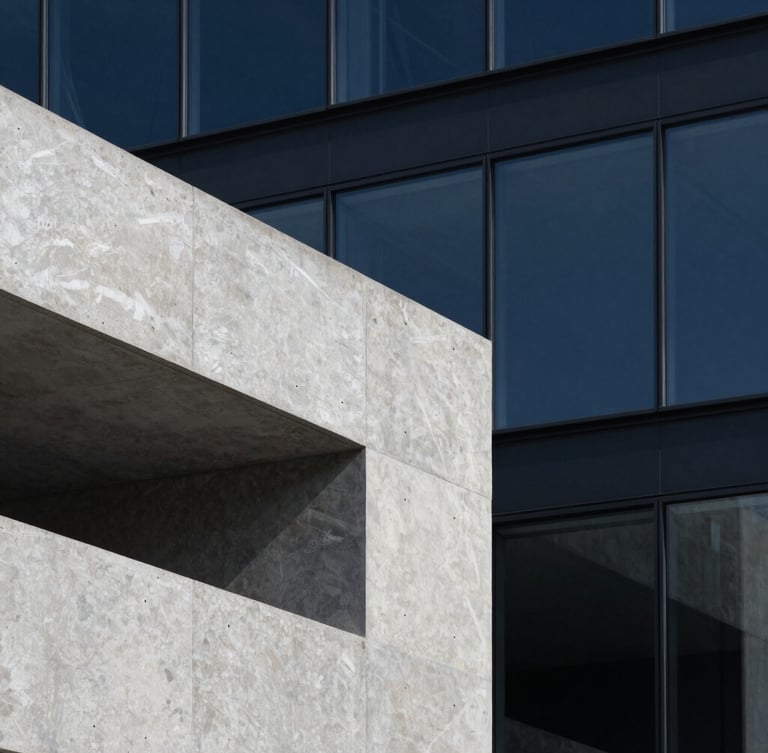 Close-up architectural detail of a minimalist concrete and glass structure, sharp shadows, cool gray slate tones, clean geometric lines.