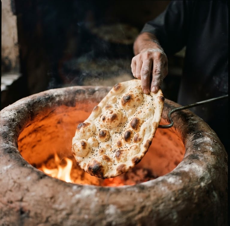 A close-up of fresh, blistered Afghan flatbread emerging from a glowing clay tandoor oven, warm dramatic side-lighting, steam rising, shallow depth of field, 35mm