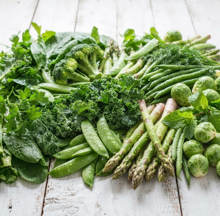Bright food photography of crisp dew-kissed green vegetables on a white wooden background, natural morning daylight, 50mm lens