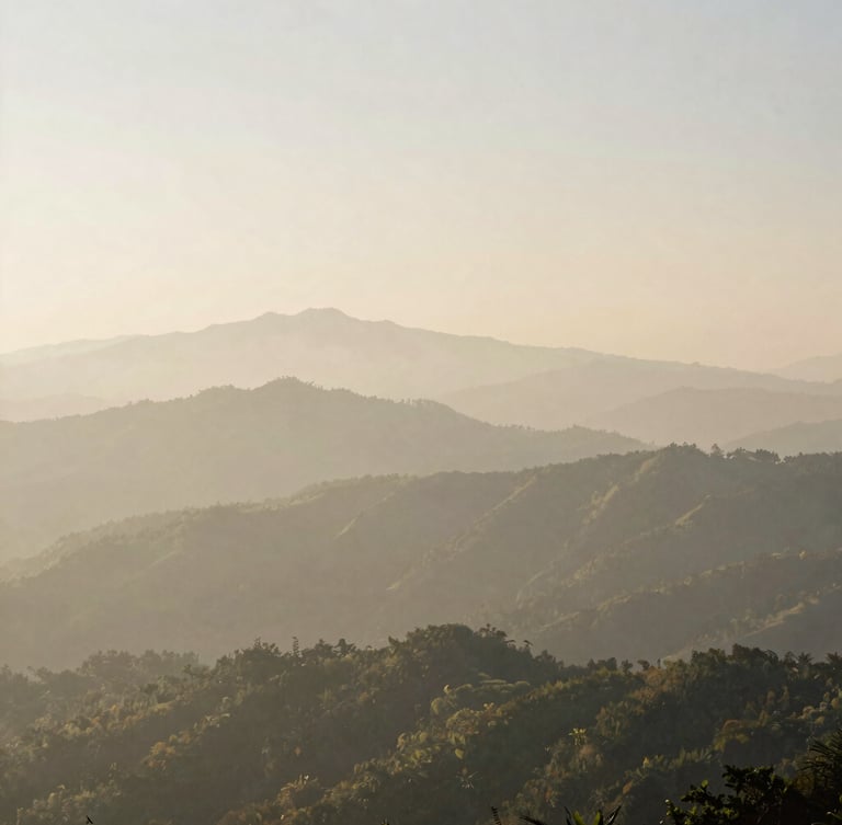 Wide panoramic view of misty mountain ranges in Southeast Asia, soft morning light, deep perspective, 35mm film