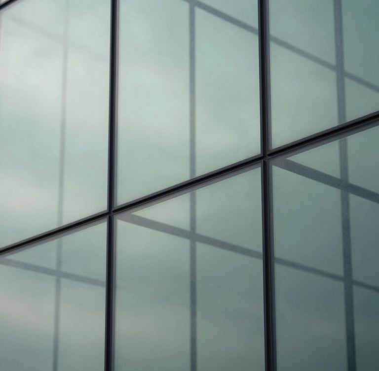 Abstract representation of mental clarity, structured geometric glass elements reflecting soft overcast daylight, cool clean tones with subtle sage green highlights, minimalist composition, 35mm lens