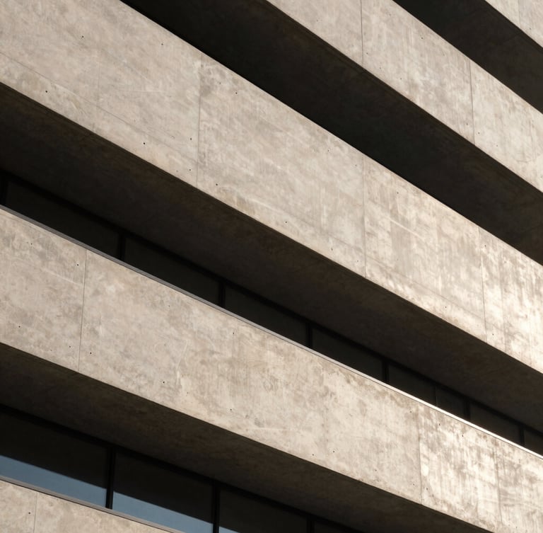 Abstract architectural detail of a modern concrete and steel facade, sharp morning daylight with deep shadows, high-contrast, elegant neutral tones, 35mm lens