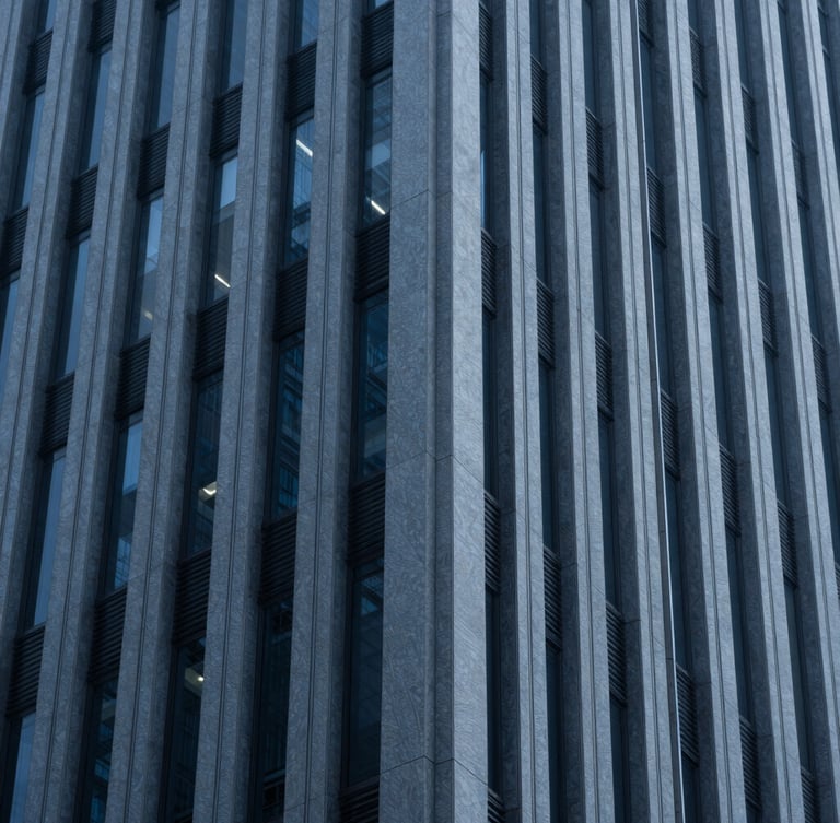 Macro shot of architectural lines of a modern corporate skyscraper, deep blue and slate tones, cool diffused light, 35mm