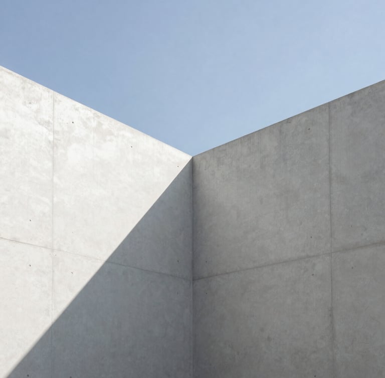 Minimalist architectural photography, clean concrete lines meeting a sharp sky, stark high-contrast natural light with deep shadows, 35mm