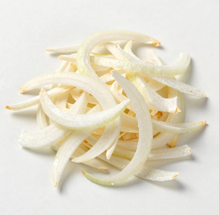 Top-down macro shot of premium dehydrated white onion flakes on a clean off-white surface under bright studio lighting, emphasizing purity and texture.