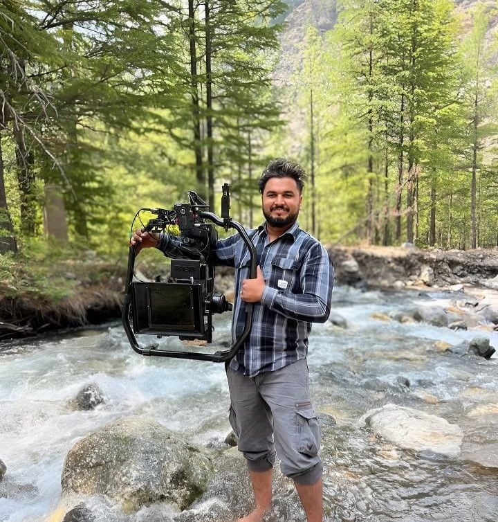 sukhvinder singh standing in a stream of water