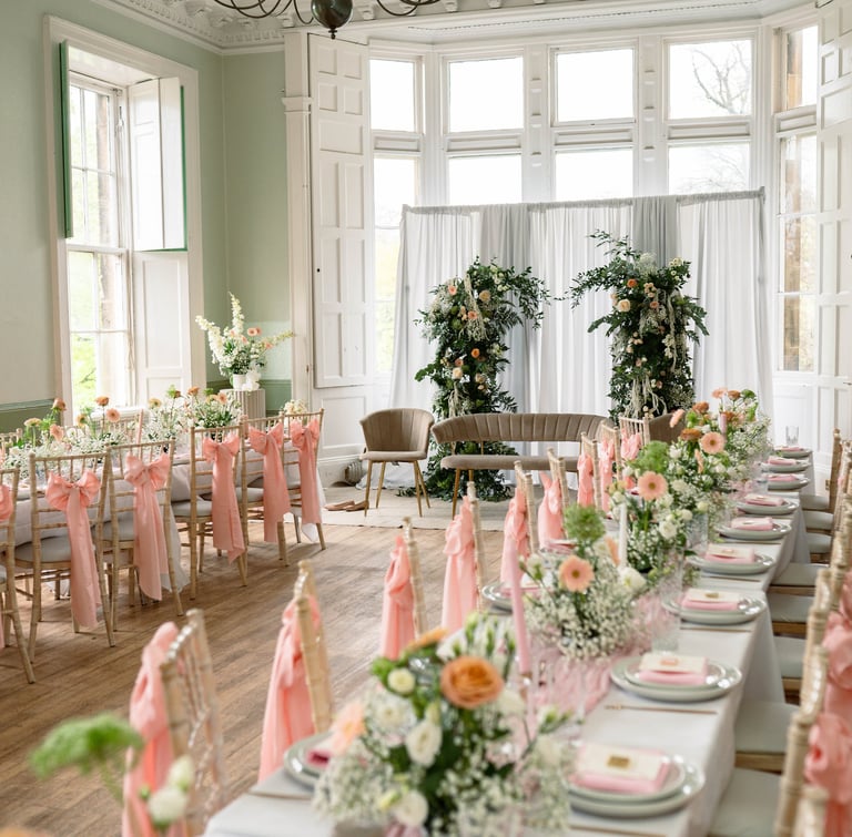 a long table with a bunch of flowers on it
