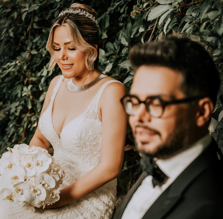 Wedding photography in London – bride and groom sitting with bouquet by Fred Art Studio.
