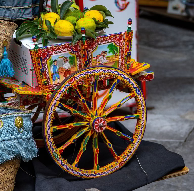 itahome  traditional Sicilian cart with fresh yellow lemons and decorative straw baskets.