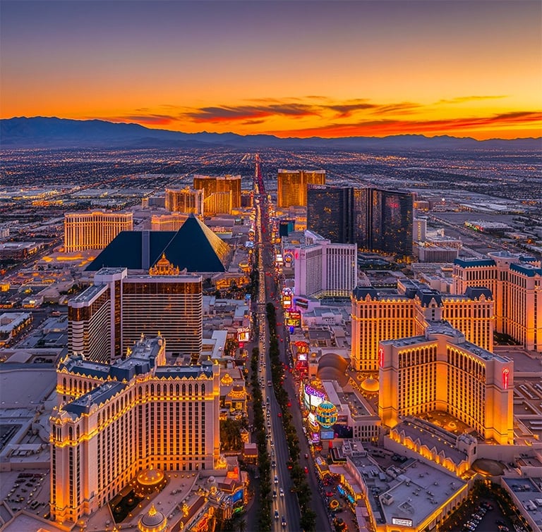 a cityscape of a city with a sunset