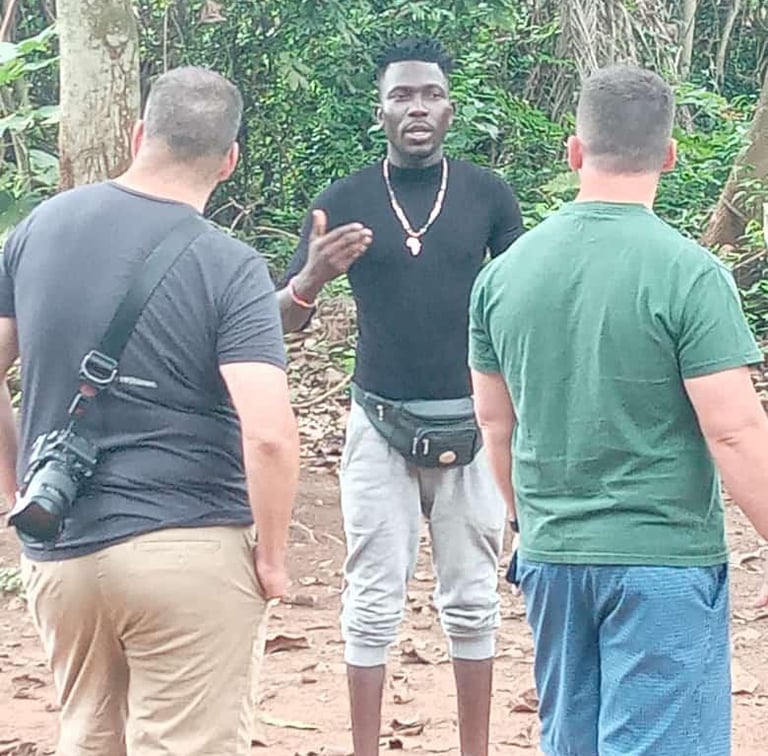 Dahomey African Tours Guide leading Tourists in the Sacred Forest in Ouidah in Benin