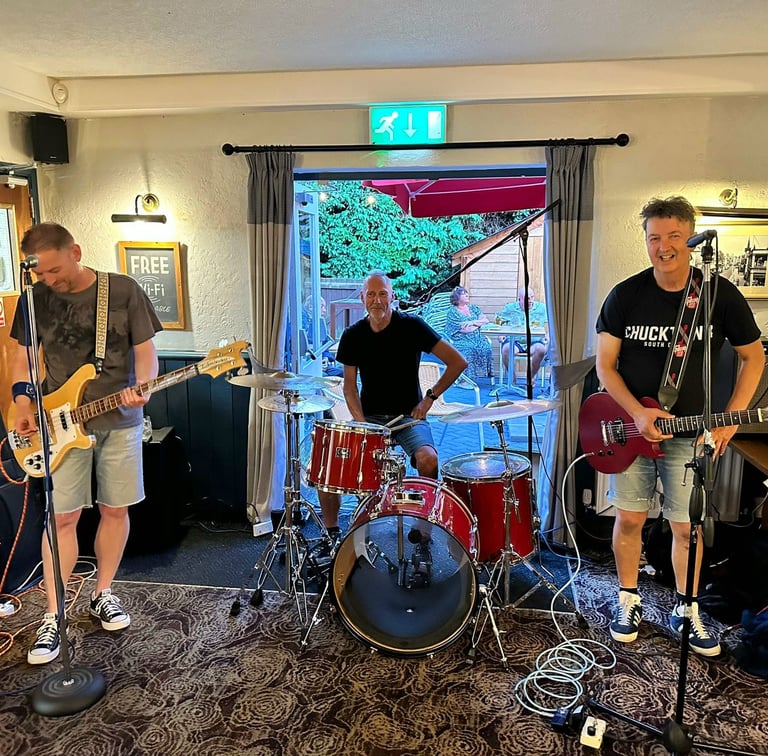 a band playing guitar in a country pub