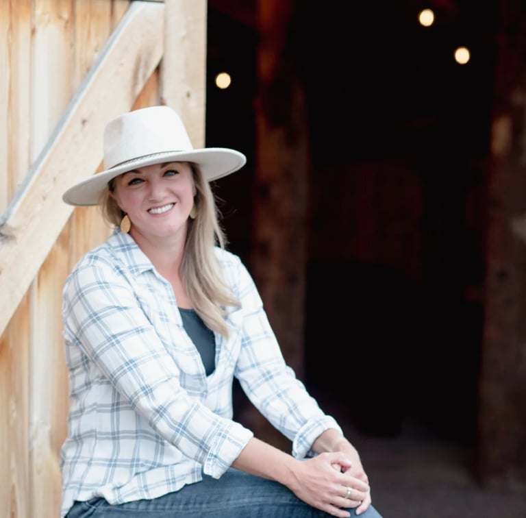 about - Christina sitting outside the barn