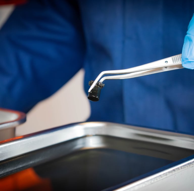 Technician performing verification and validation testing on a medical device