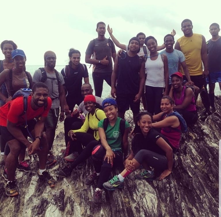 a group of young hiker standing on a rock formation