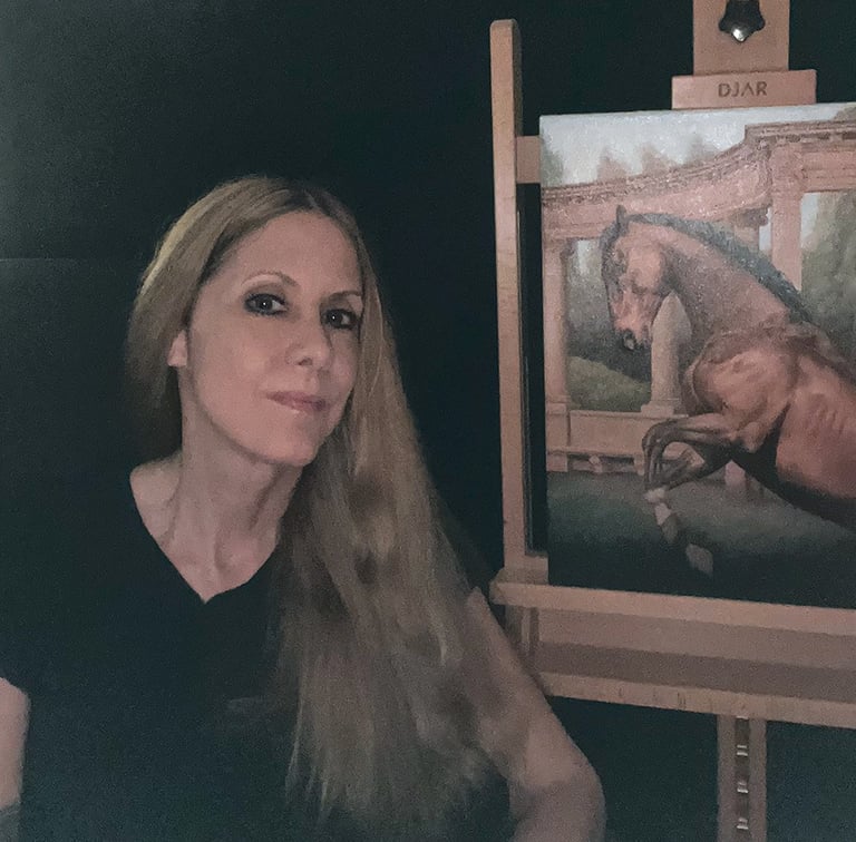 Artist Carla Millar at her easel with an original oil painting.